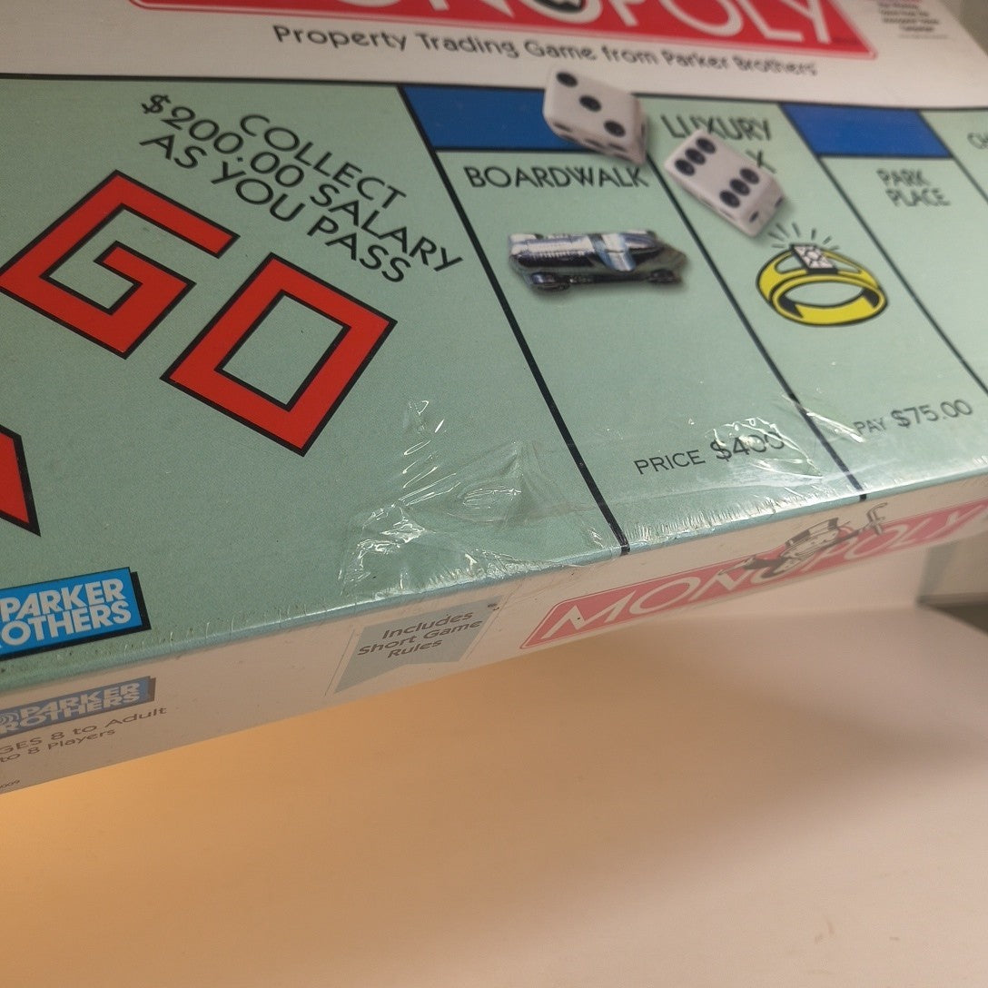 Monopoly Property Trading Board Game - 1999 Hasbro USA - Sealed Torn Plastic